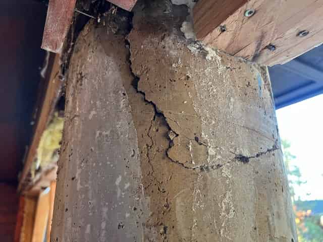 Cracked, deteriorating reinforced concrete column of the kind addressed by FRP shear strengthening